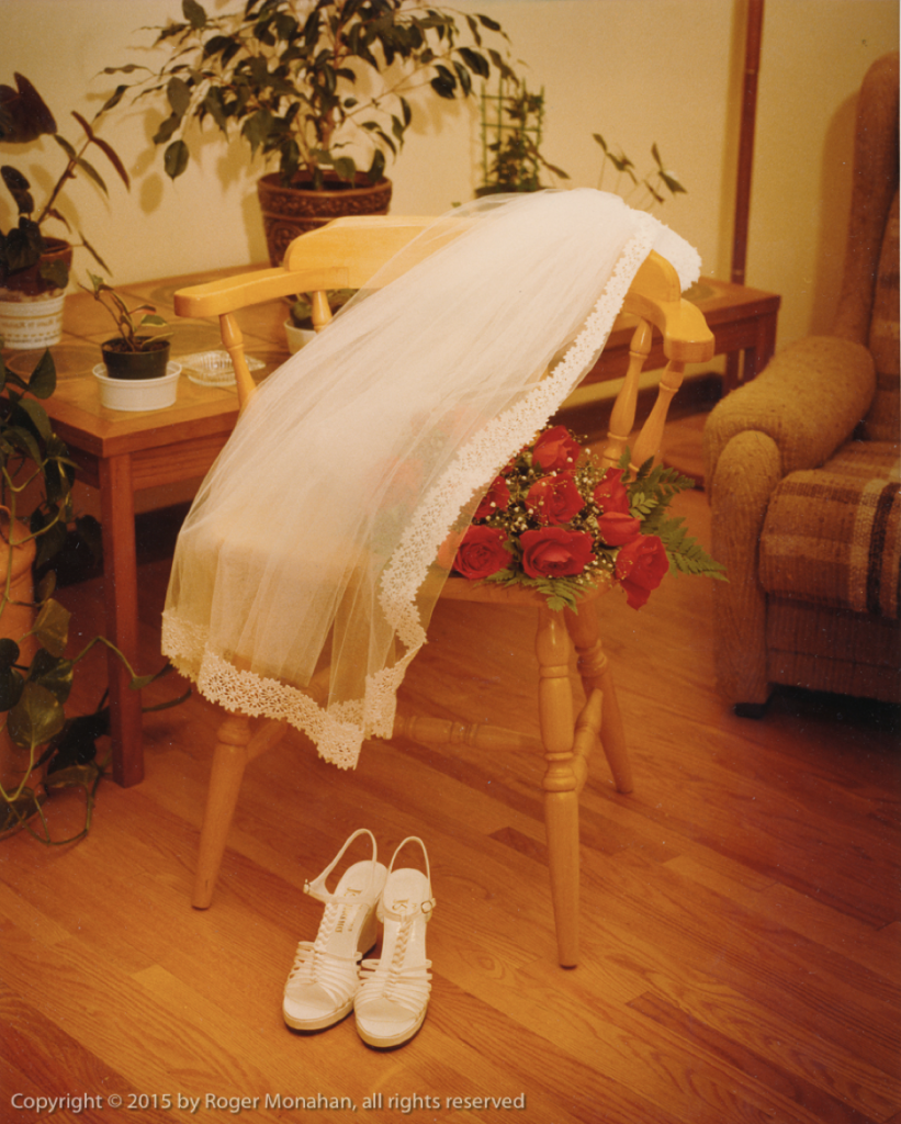 Still life of bride's veil, shoes and bouquet.