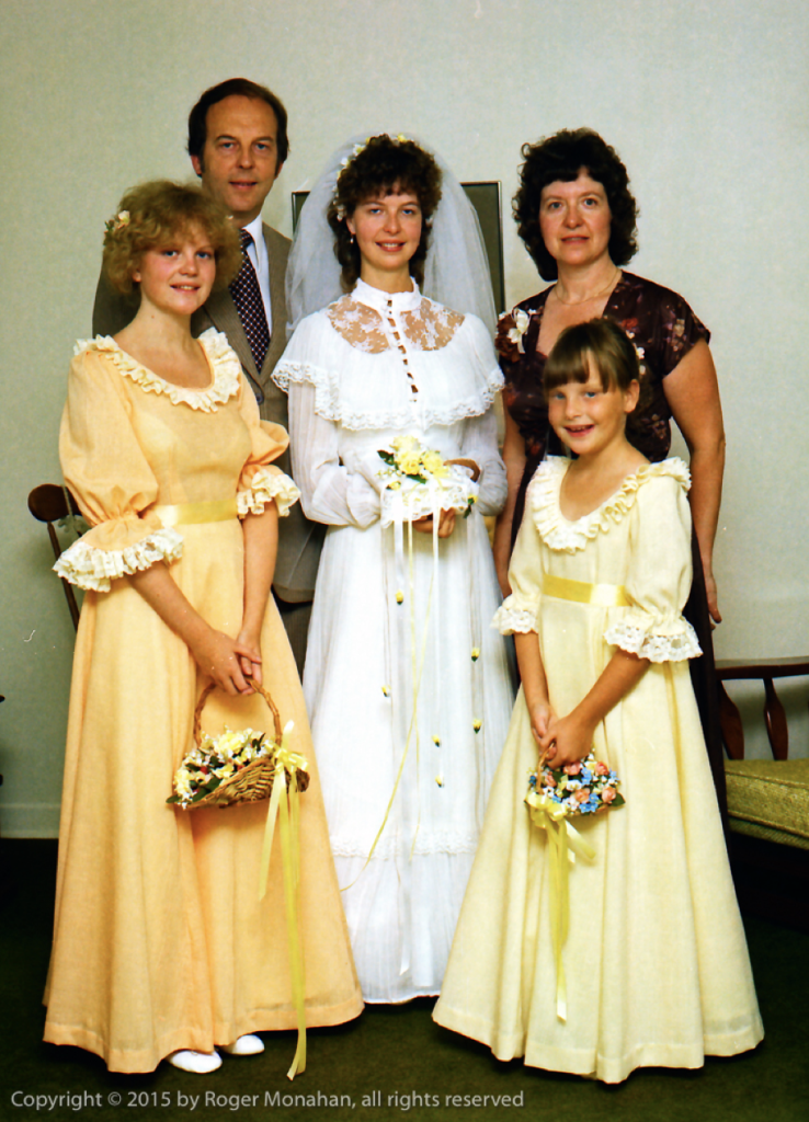 Bride with family, standing group shot.