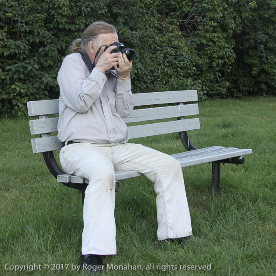 Photo showing stance to hold camera steady while seated on a bench.