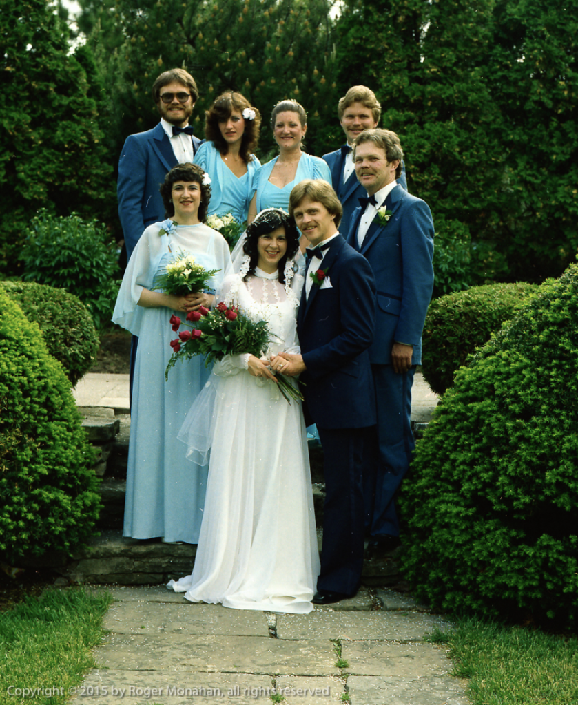 Bride and groom with bridal party, standing